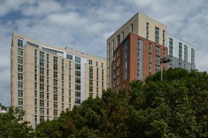 an exterior view of Queens Court apartments